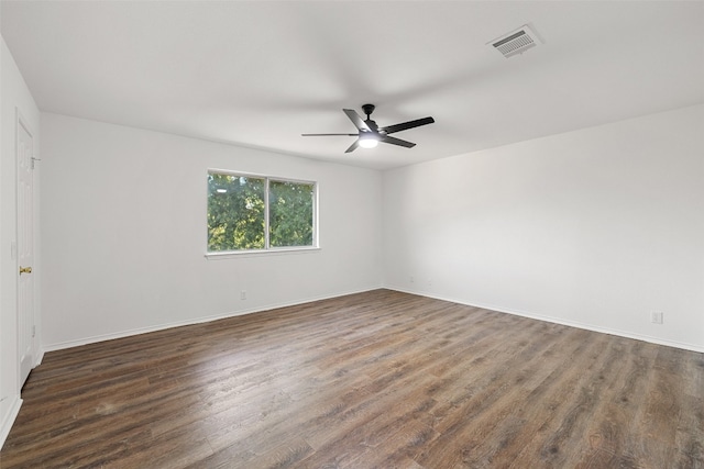 unfurnished room with ceiling fan and dark hardwood / wood-style floors