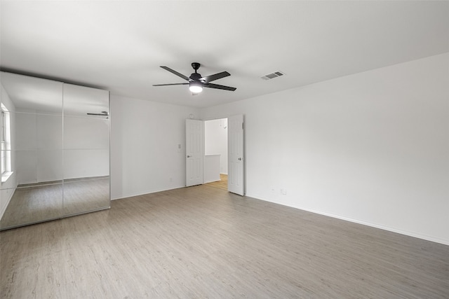 spare room featuring ceiling fan and wood-type flooring