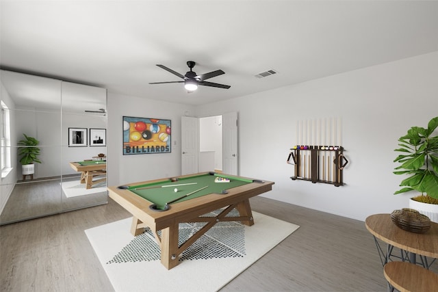 recreation room featuring ceiling fan, hardwood / wood-style flooring, and billiards