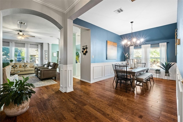 dining space with a wealth of natural light, visible vents, and hardwood / wood-style floors