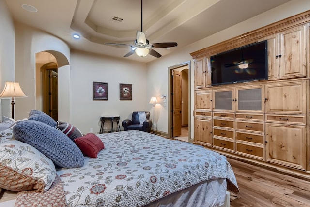 bedroom featuring ceiling fan and light hardwood / wood-style flooring