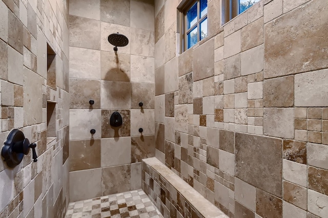 bathroom with tiled shower