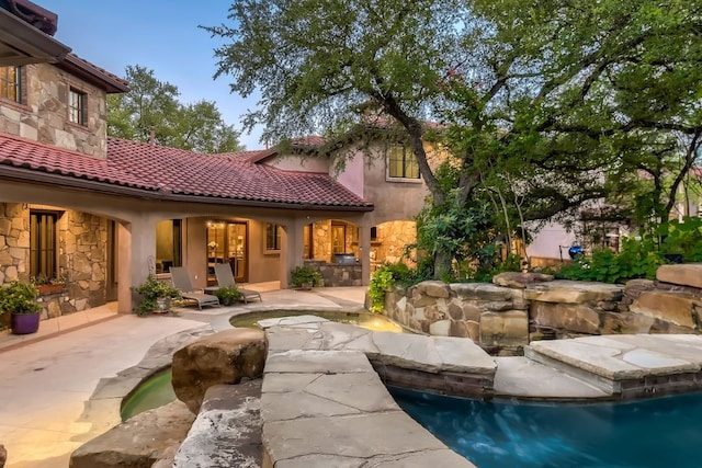 rear view of house with a patio area