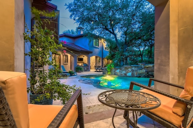 view of pool featuring a patio