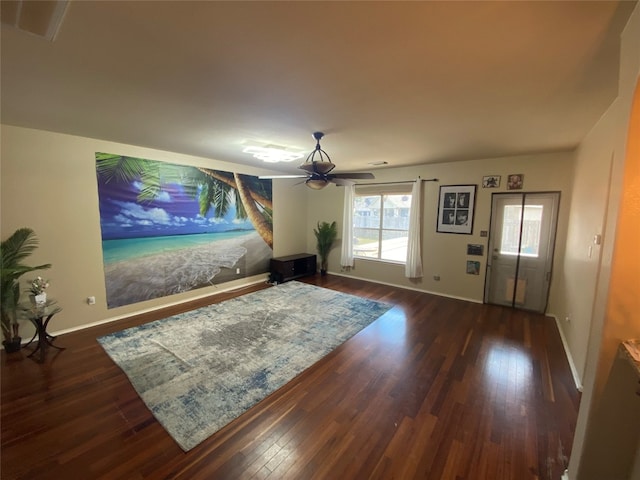 interior space with ceiling fan and dark hardwood / wood-style floors