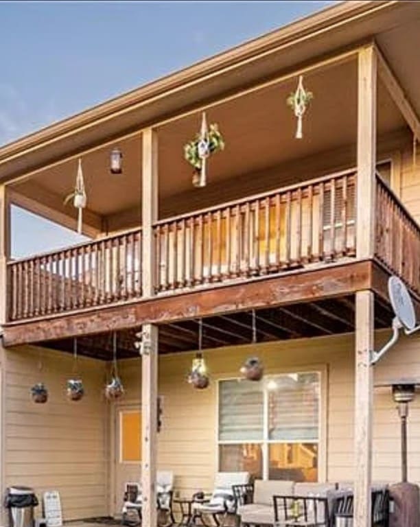 rear view of property with a balcony