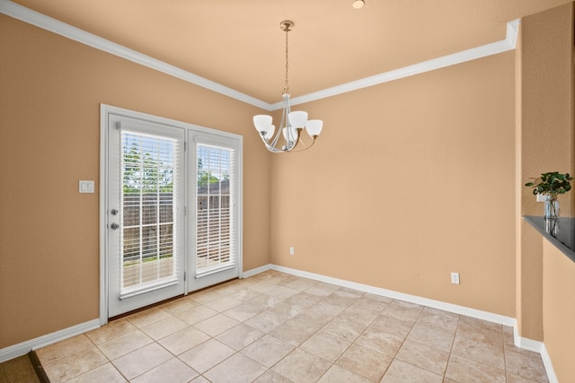 unfurnished dining area with tile patterned flooring, a chandelier, and ornamental molding