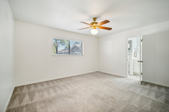 empty room with ceiling fan and carpet