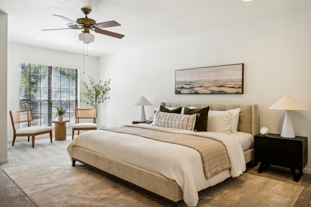 carpeted bedroom featuring ceiling fan