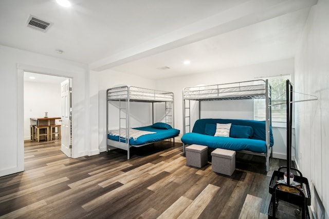 bedroom with dark hardwood / wood-style floors