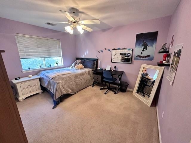 bedroom with light colored carpet and ceiling fan