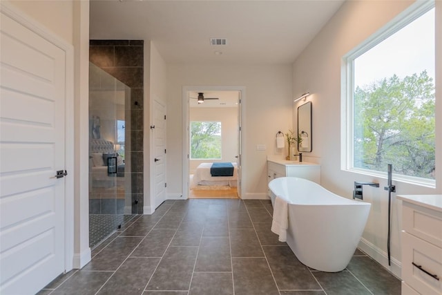 bathroom with vanity, plenty of natural light, independent shower and bath, and ceiling fan