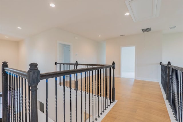 corridor with light hardwood / wood-style flooring