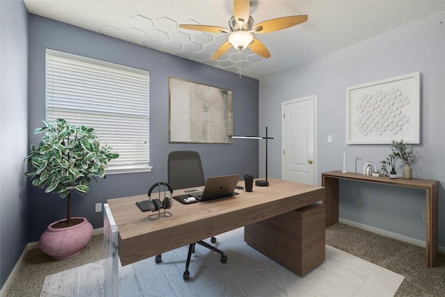 carpeted office with ceiling fan