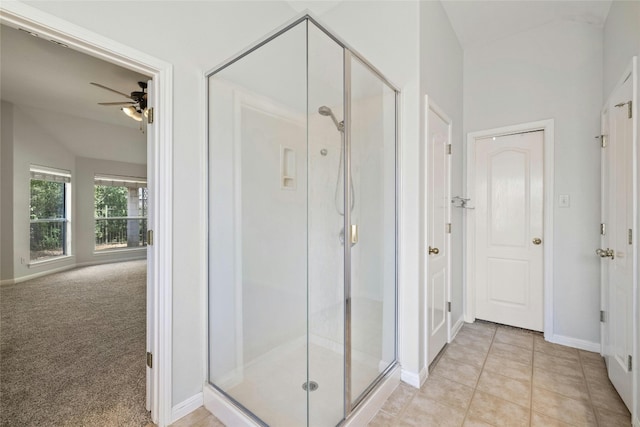 bathroom with walk in shower, ceiling fan, and tile patterned floors