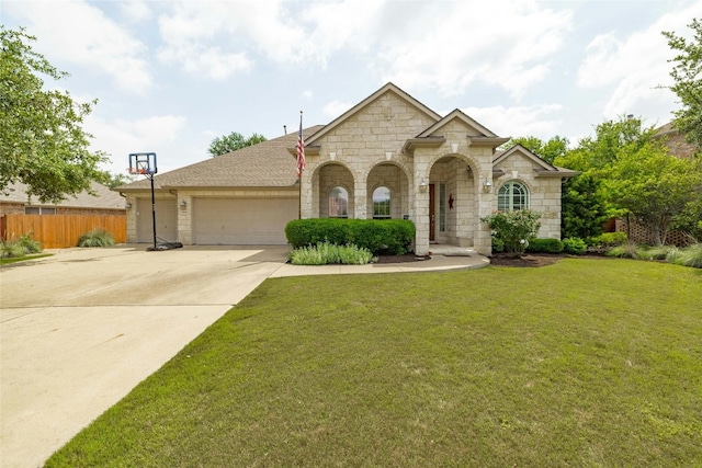 view of front of property with a front lawn and a garage