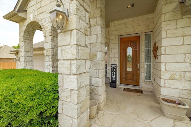 doorway to property featuring a garage