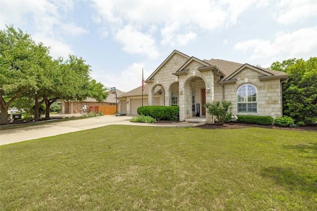 view of front of property with a garage and a front yard