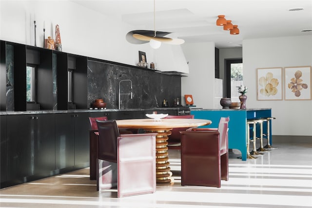 kitchen featuring backsplash and a kitchen island