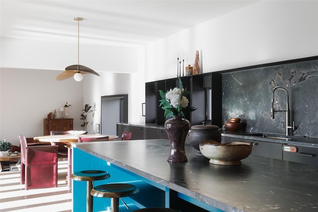 kitchen featuring sink and decorative light fixtures