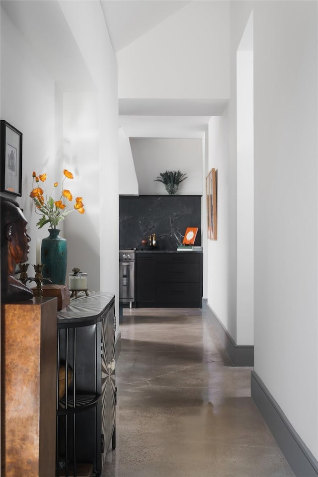 hallway featuring lofted ceiling