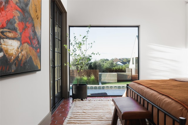 bedroom with dark tile patterned flooring