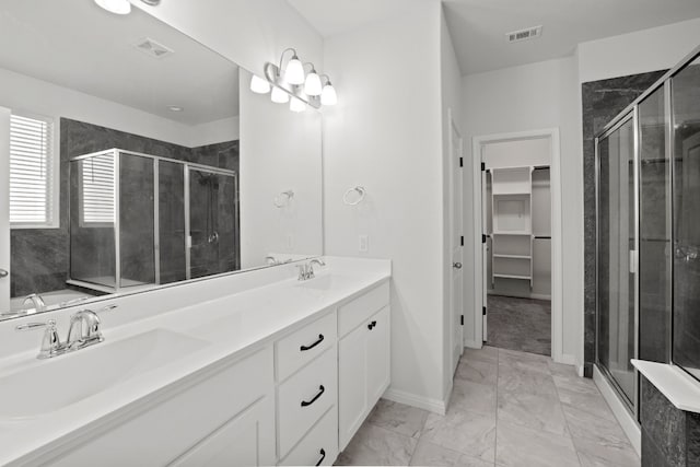 bathroom with vanity and an enclosed shower