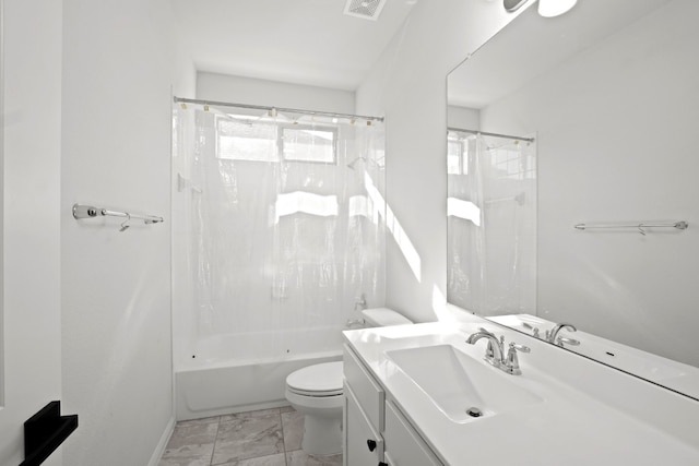 full bathroom with vanity, tiled shower / bath combo, and toilet