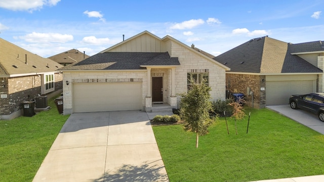 view of front of property featuring central AC unit, a front yard, and a garage