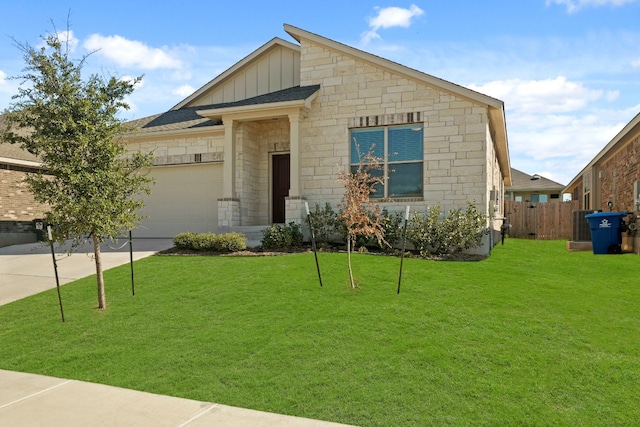 view of front of property with a garage and a front lawn