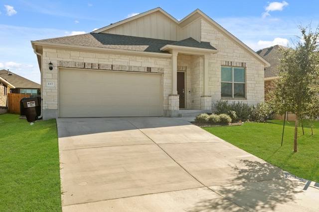 view of front facade with a garage and a front yard