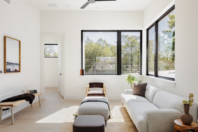 interior space featuring ceiling fan and light hardwood / wood-style flooring