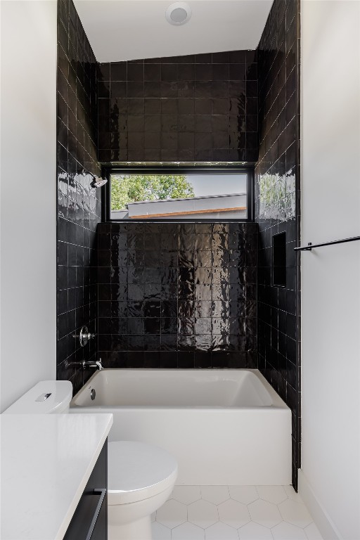 full bathroom featuring toilet, bathtub / shower combination, tile patterned floors, and vanity