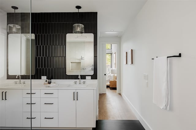 bathroom with vanity and hardwood / wood-style flooring