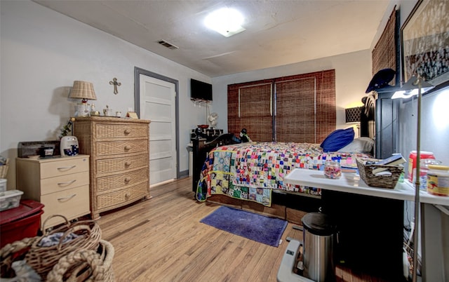 bedroom featuring light hardwood / wood-style floors