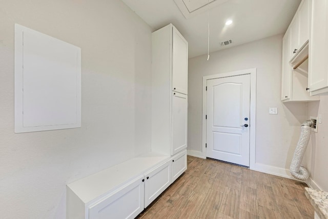 mudroom with light hardwood / wood-style floors