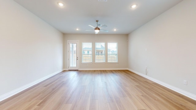 empty room featuring light hardwood / wood-style floors and ceiling fan