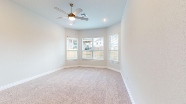 carpeted empty room with ceiling fan