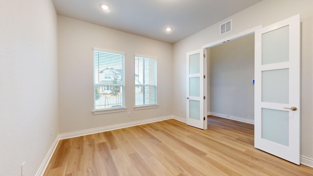 empty room with light wood-type flooring