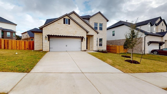 view of front of home with a garage and a front lawn