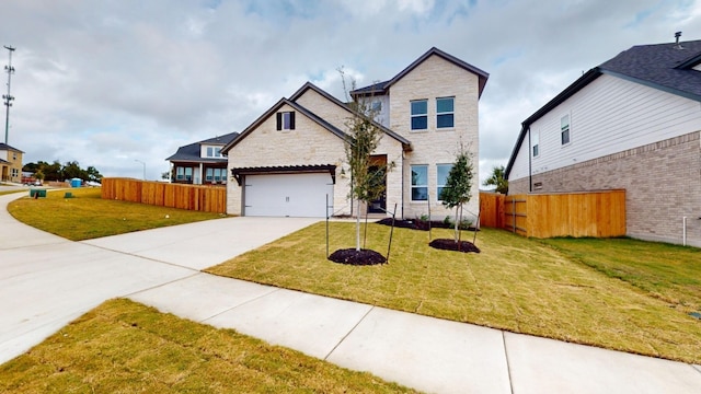 view of front of house featuring a front yard and a garage