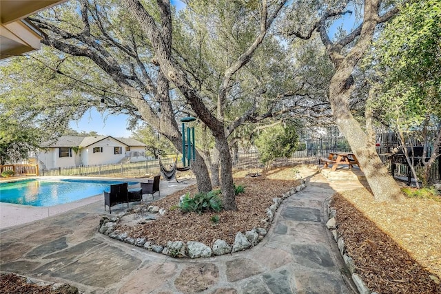 3110 Point Cv, Lago Vista, TX 78645 - fenced backyard featuring a patio