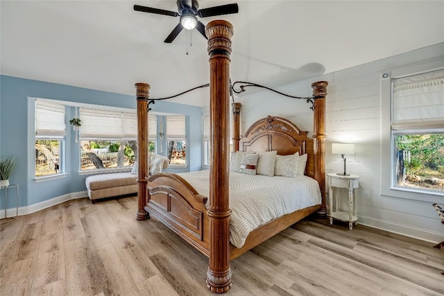 3110 Point Cv, Lago Vista, TX 78645 - bedroom featuring light wood finished floors, multiple windows, and a ceiling fan