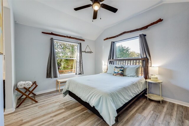 3110 Point Cv, Lago Vista, TX 78645 - bedroom with lofted ceiling, multiple windows, wood finished floors, and ceiling fan