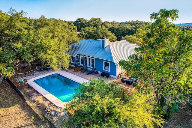 view of pool with a grill and a patio area