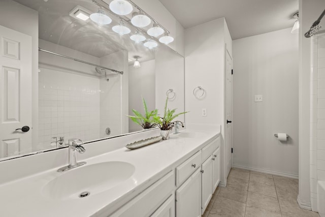 bathroom featuring tile patterned flooring, a shower, and vanity