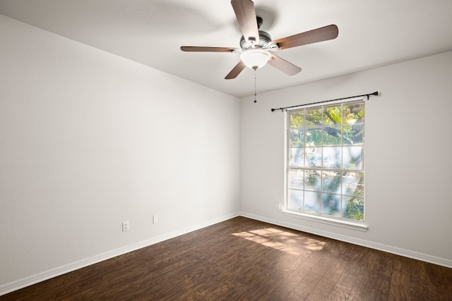 empty room featuring ceiling fan and dark hardwood / wood-style floors