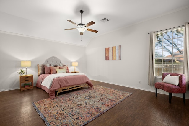 bedroom with lofted ceiling, ornamental molding, dark hardwood / wood-style flooring, and ceiling fan