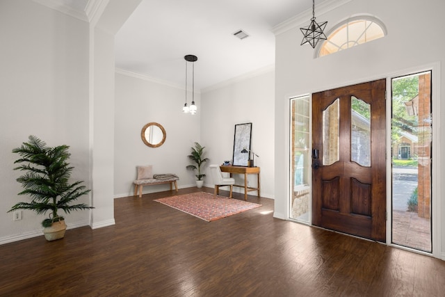 entrance foyer with crown molding and dark hardwood / wood-style floors