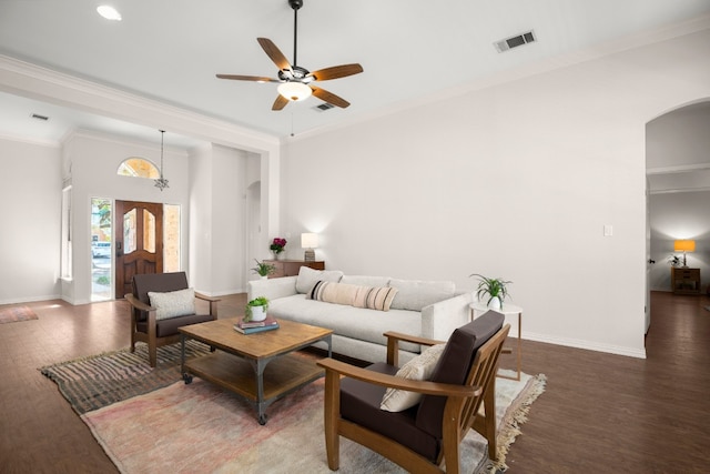 living room featuring ceiling fan, crown molding, and dark hardwood / wood-style flooring